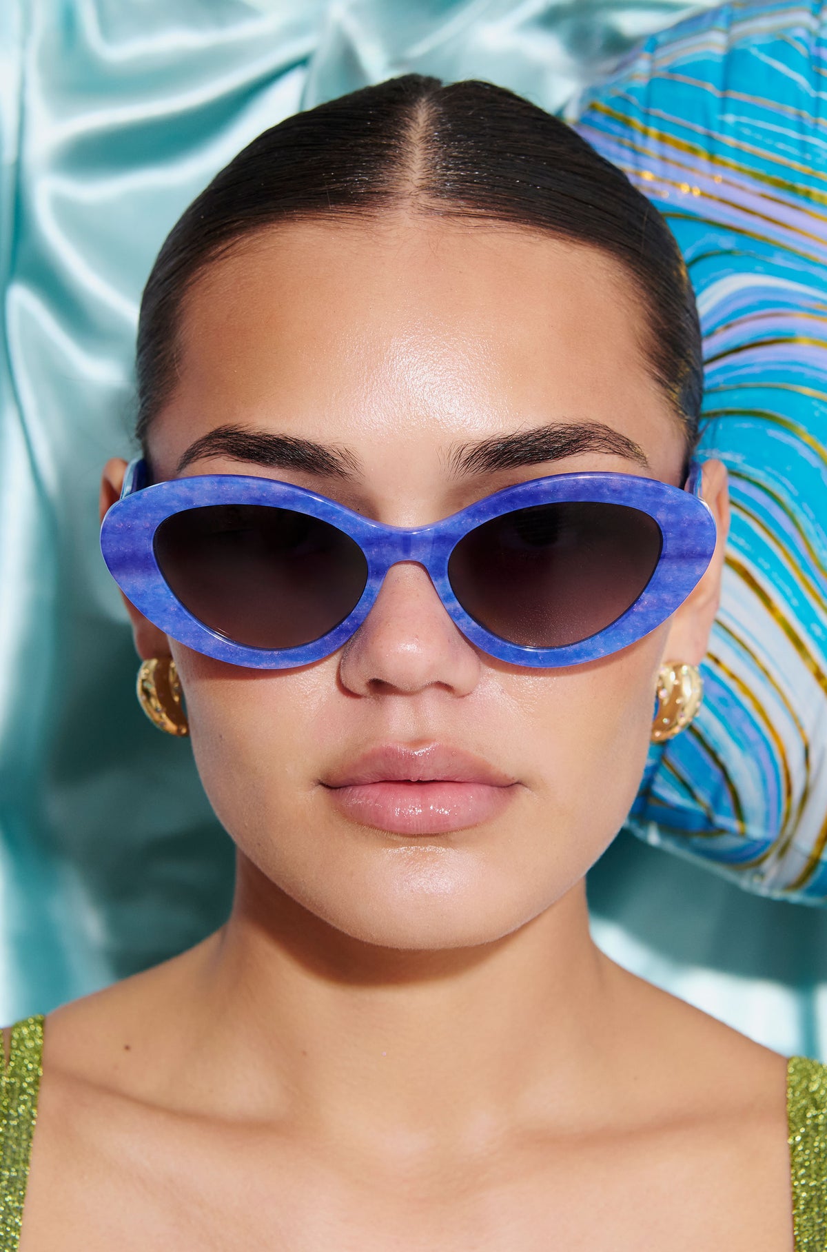 AZURIA ~ Oval shaped sunglasses in a luminous imperial blue with pink shimmer
