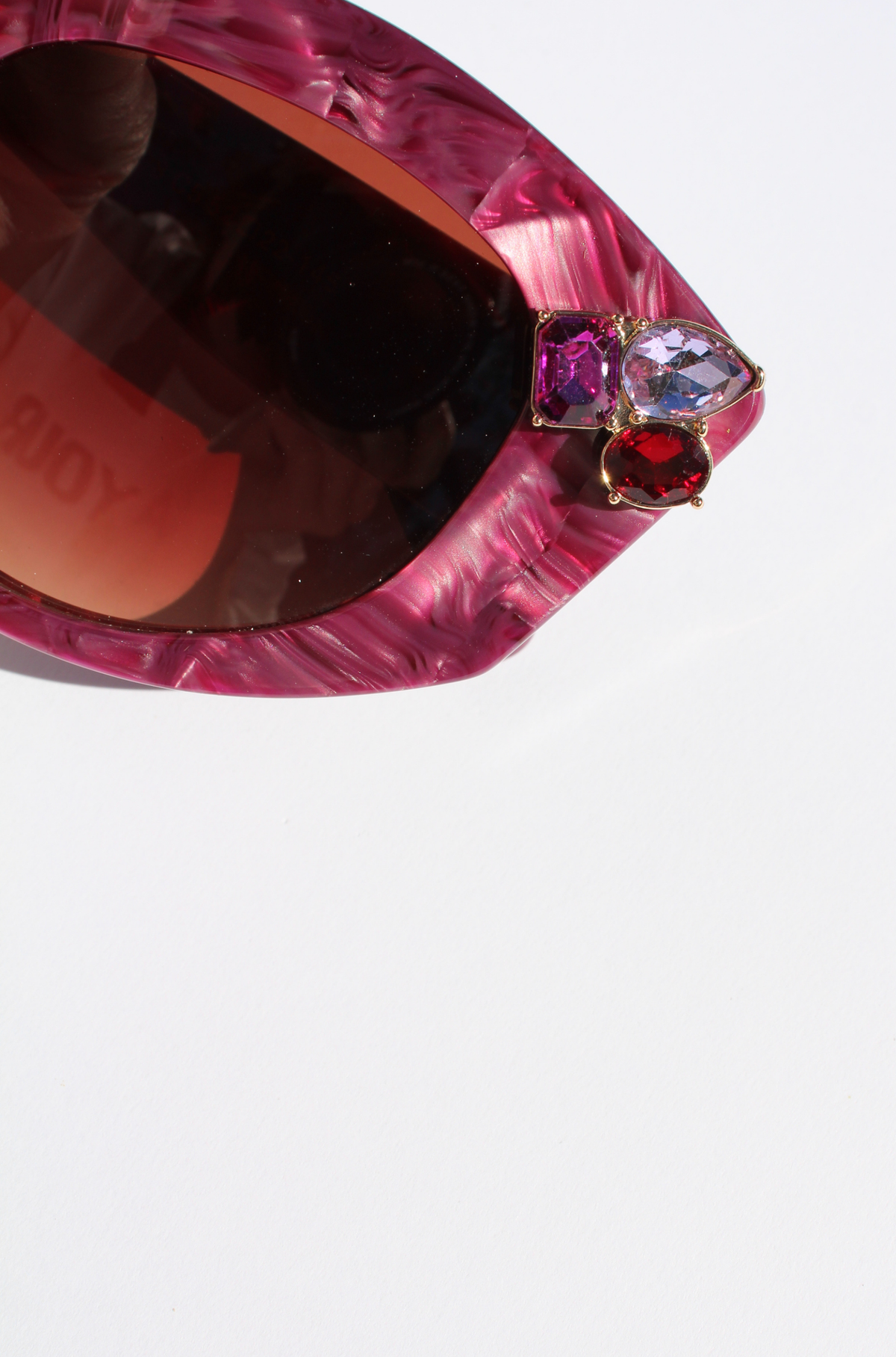 RUBEYE ~ Modern cateye sunglasses in a radiant marbled crimson acetate with crystal embellishments