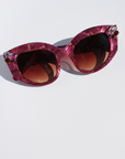 RUBEYE ~ Modern cateye sunglasses in a radiant marbled crimson acetate with crystal embellishments
