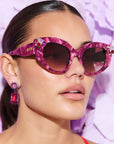 RUBEYE ~ Modern cateye sunglasses in a radiant marbled crimson acetate with crystal embellishments