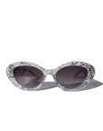 SILVELLE ~ Oval shaped sunglasses in clear acetate sprinkled with iridescent silver love heart sequins