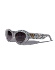 SILVELLE ~ Oval shaped sunglasses in clear acetate sprinkled with iridescent silver love heart sequins