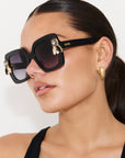 LIQUORICH ~ Oversized rounded square sunglasses in luminous black glitter acetate with crystal embellishments