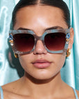 SKYSHINE ~ Oversized square sunglasses in a pale blue and shimmering apricot acetate with statement crystal embellishments