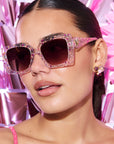 GLITTERATI ~ Square shaped sunglasses in silver glitter with a confetti of pink hearts and peach sequins