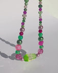 GUAVA GLOW ~ Handmade statement necklace featuring a green glitter centrepiece with emerald green and fuchsia beads