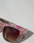 Kaleida ~ Pink two-tone cat-eye sunglasses with star glitter and multi-coloured patterned acetate